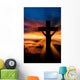 A cross at sundown on the ocean Wall Mural