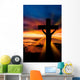A cross at sundown on the ocean Wall Mural