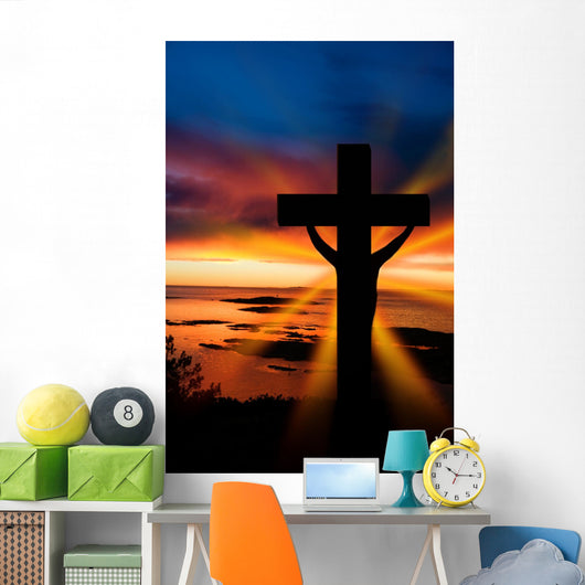 A cross at sundown on the ocean Wall Mural