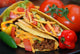 Tacos on plate with tomatoes, habanero and serano peppers. Wall Mural