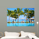 Swimming pool with  umbrellas on beach in Mauritius Wall Mural