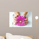 Hands with stylish dark manicure and pink flower 