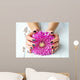 Hands with stylish dark manicure and pink flower 