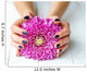 Hands with stylish dark manicure and pink flower 