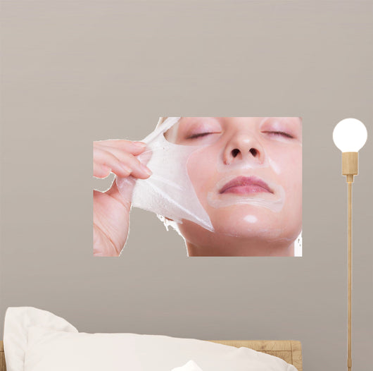 Portrait blond girl in facial mask. Beauty and skin care. 