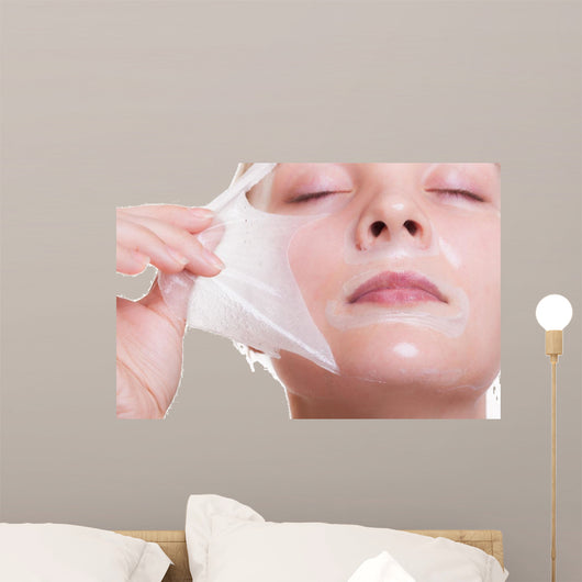 Portrait blond girl in facial mask. Beauty and skin care. 