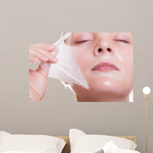 Portrait blond girl in facial mask. Beauty and skin care. 
