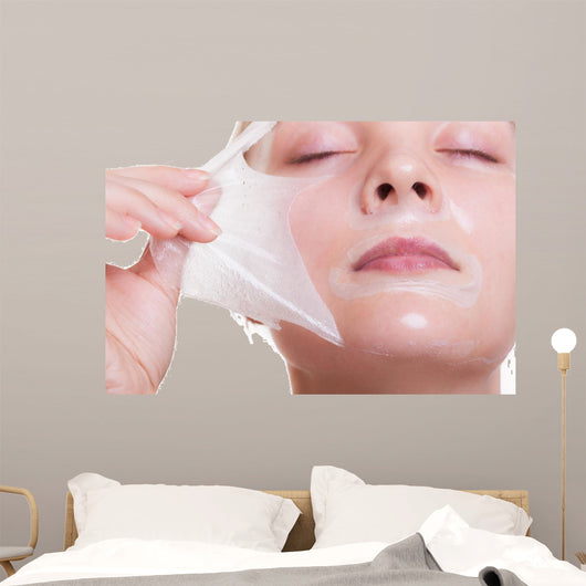Portrait blond girl in facial mask. Beauty and skin care. 