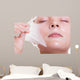 Portrait blond girl in facial mask. Beauty and skin care. 