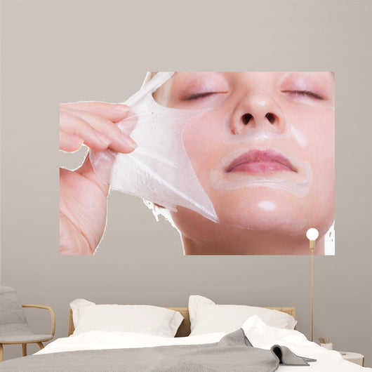 Portrait blond girl in facial mask. Beauty and skin care. 
