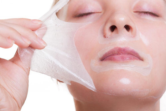 Portrait blond girl in facial mask. Beauty and skin care. 