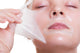 Portrait blond girl in facial mask. Beauty and skin care. 