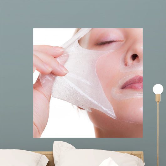 Portrait blond girl in facial mask. Part face. Beauty skin care. 