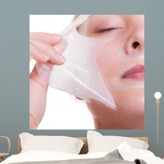 Portrait blond girl in facial mask. Part face. Beauty skin care. 