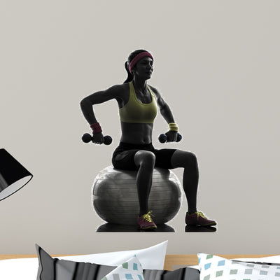 Woman Exercising Fitness Ball shown on a wall