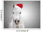 White christmas horse with santa hat on gray background snowfall 