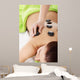 Beautiful woman lying on spa salon. 