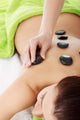 Beautiful woman lying on spa salon. 