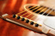 Acoustic guitar bridge and strings close up Wall Mural