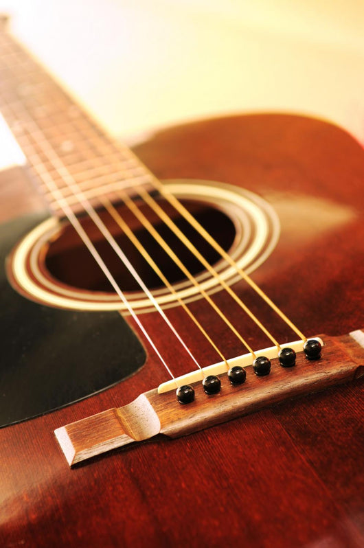Musical instrument acoustic guitar close up in perspective Wall Mural