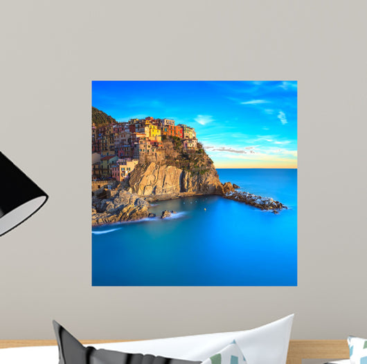 Manarola village, rocks and sea at sunset. Cinque Terre, Italy 