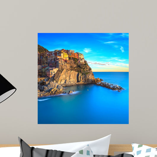 Manarola village, rocks and sea at sunset. Cinque Terre, Italy 