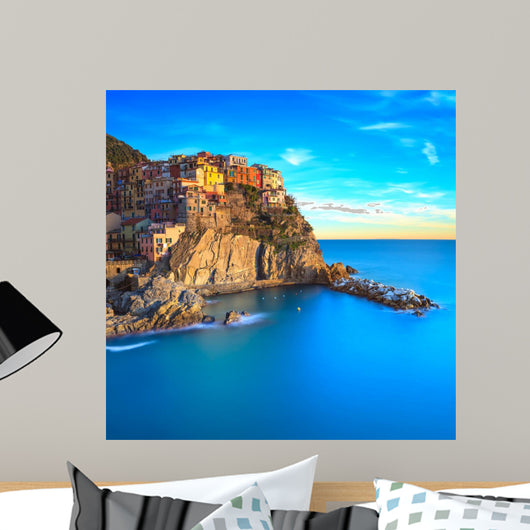 Manarola village, rocks and sea at sunset. Cinque Terre, Italy 