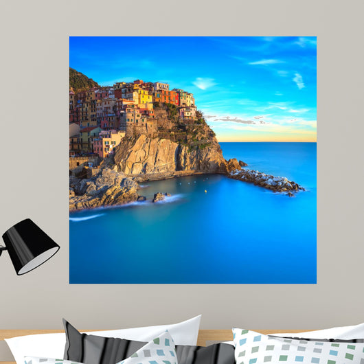 Manarola village, rocks and sea at sunset. Cinque Terre, Italy 