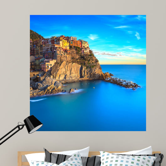 Manarola village, rocks and sea at sunset. Cinque Terre, Italy 