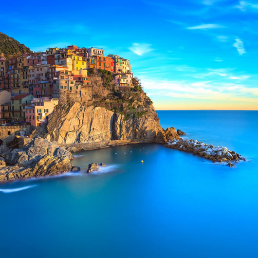 Manarola village, rocks and sea at sunset. Cinque Terre, Italy 
