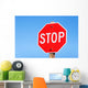 Stop sign on a road Wall Mural