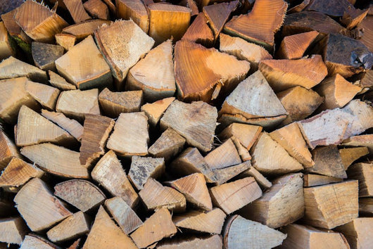 Dry Chopped Firewood Logs in a Pile 