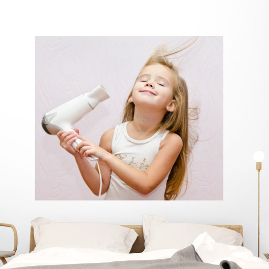 Cute Smiling Little Girl Dries Hair 