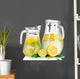Cold water with lime, lemon and ice in pitchers isolated 