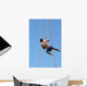 Shirtless athlete climbing up the rope Wall Mural