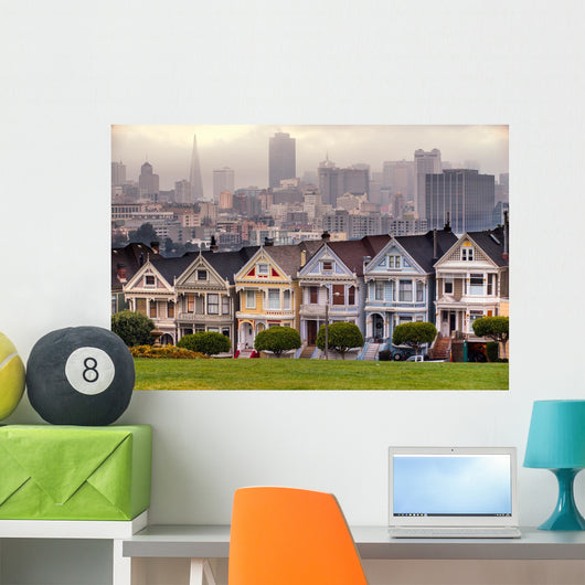 The Painted Ladies of San Francisco, California sit glowing amid Wall Mural