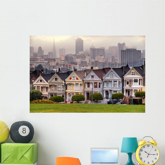 The Painted Ladies of San Francisco, California sit glowing amid Wall Mural