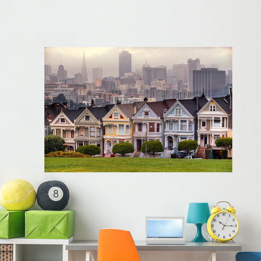 The Painted Ladies of San Francisco, California sit glowing amid Wall Mural