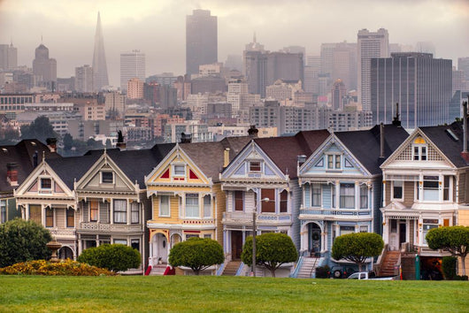 The Painted Ladies of San Francisco, California sit glowing amid Wall Mural