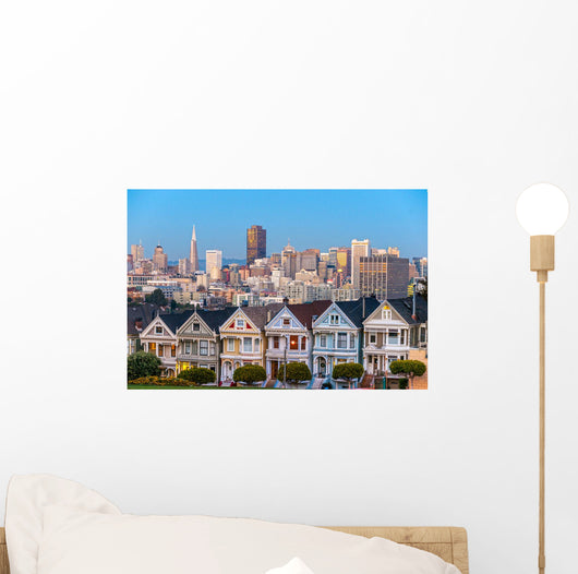 The Painted Ladies of San Francisco, California sit glowing amid Wall Mural
