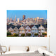 The Painted Ladies of San Francisco, California sit glowing amid Wall Mural