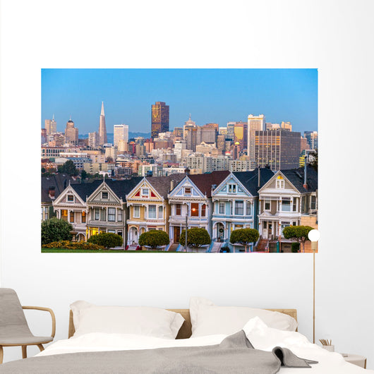The Painted Ladies of San Francisco, California sit glowing amid Wall Mural