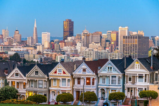 The Painted Ladies of San Francisco, California sit glowing amid Wall Mural