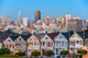 The Painted Ladies of San Francisco, California sit glowing amid Wall Mural