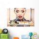 Beautiful young woman eating sushi. Shallow depth of field, focu 