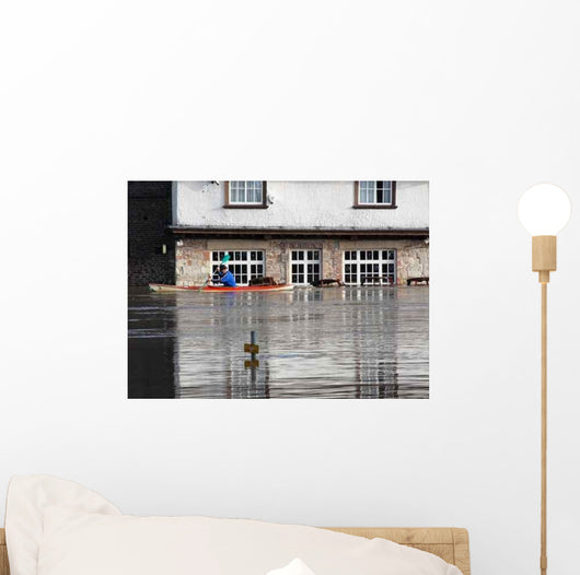 Canoeist Paddles past Flooded Wall Decal