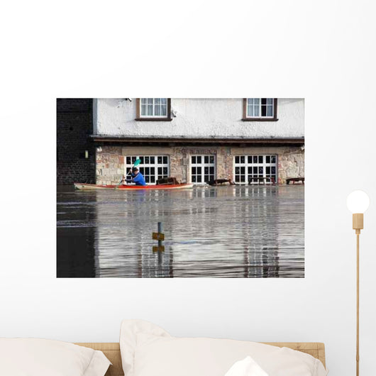 Canoeist Paddles past Flooded Wall Decal