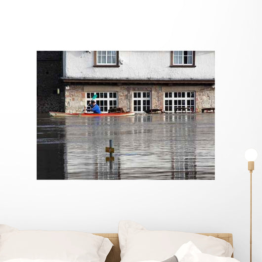 Canoeist Paddles past Flooded Wall Decal