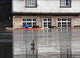 Canoeist Paddles past Flooded Wall Decal