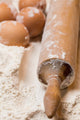 Cooking. Rolling pin and eggs in the flour 